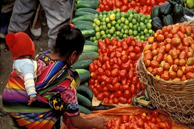 Buying food at the market. Curt Carnemark / World Bank